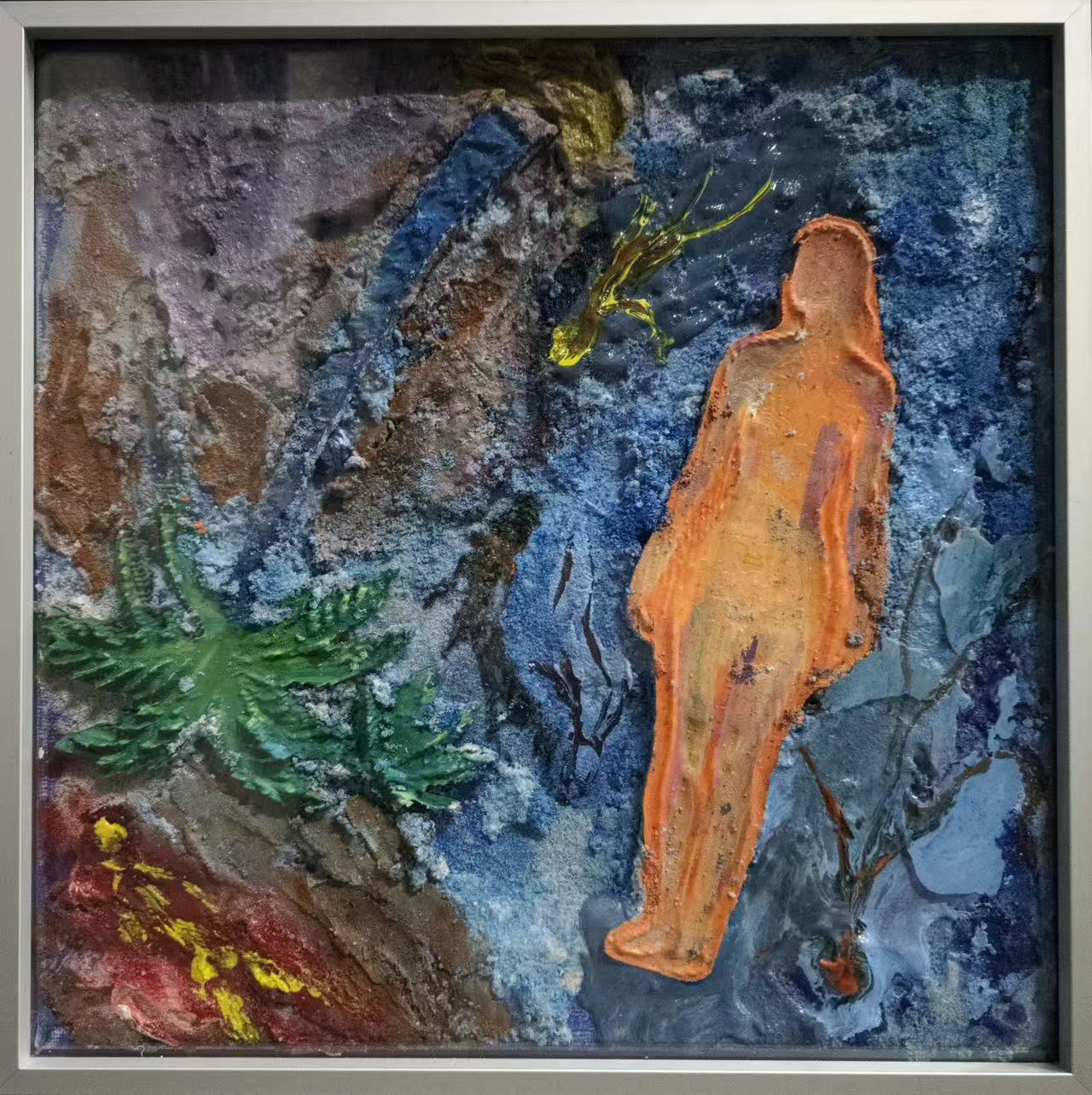 Mixed-media artwork: orange figure in a blue landscape