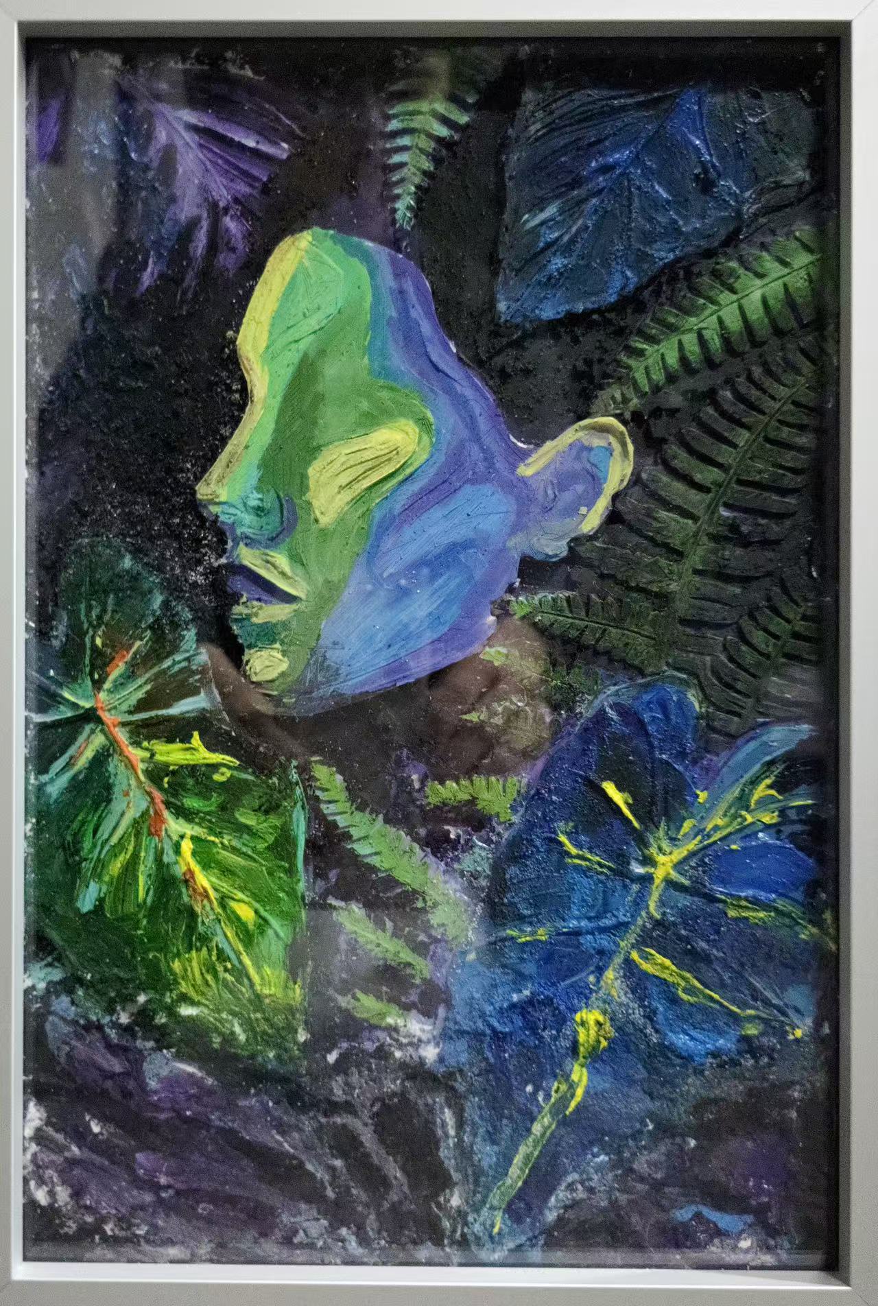Mixed-media artwork: green and blue figure among leaves